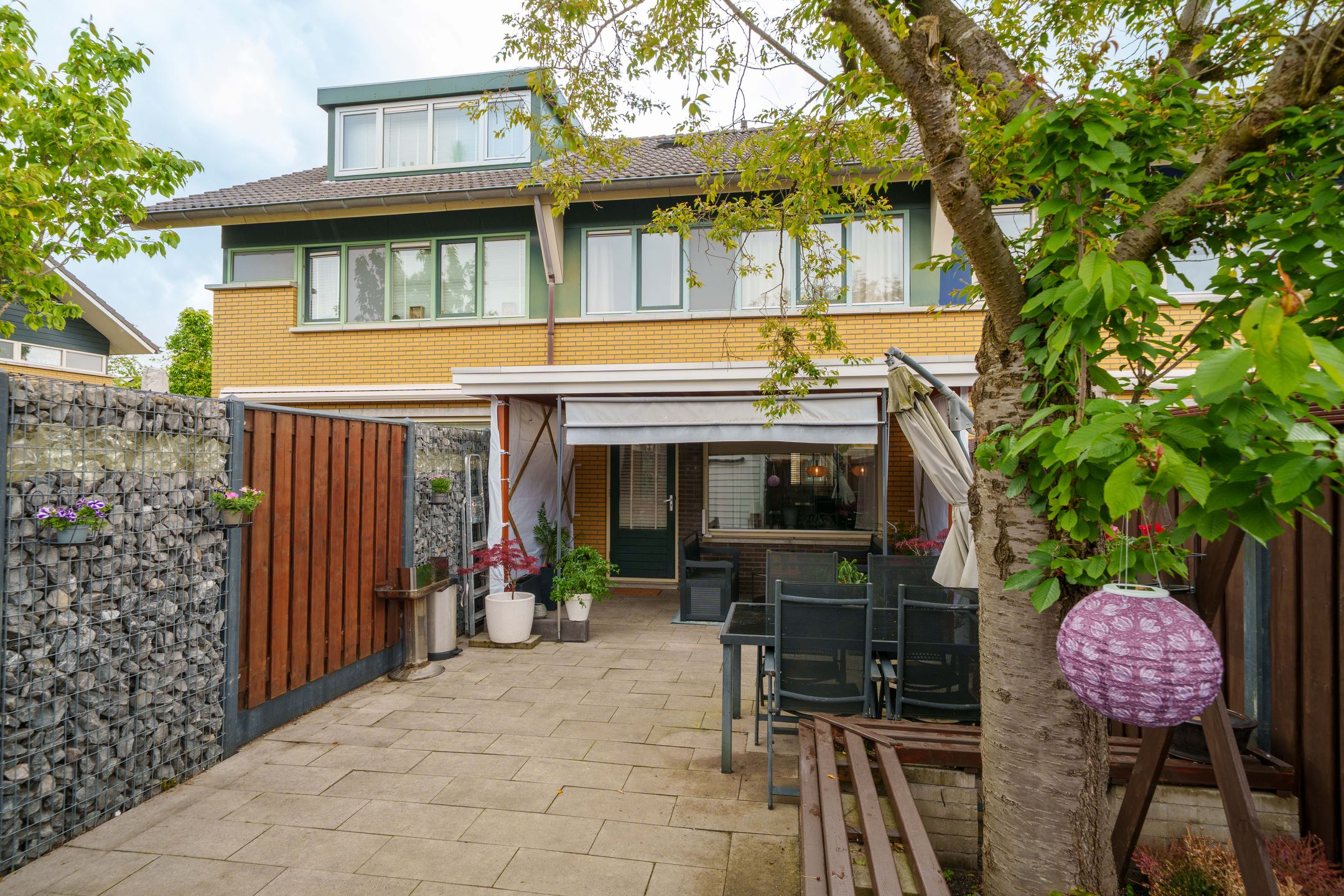 Well-maintained terraced home with sunny southwest garden and modern kitchen in family-friendly Almere neighborhood — 27