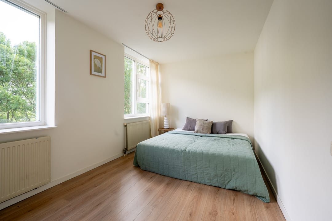 Spacious and Light Apartment with Canal View and Private Land in Diemen — 16