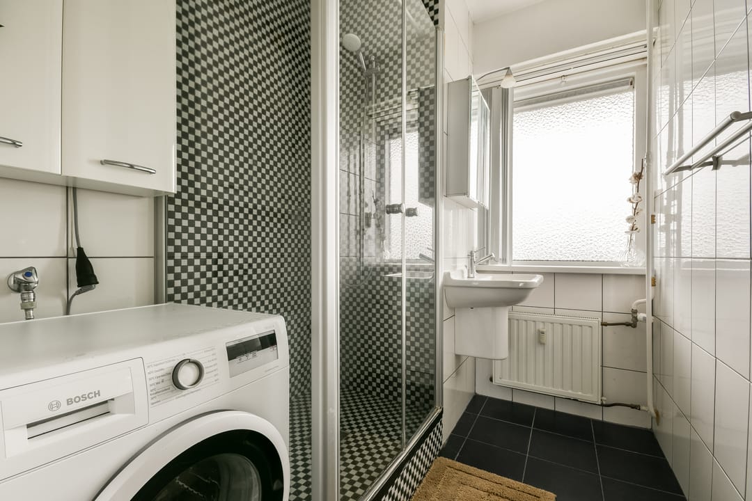 Bright 11th Floor Apartment with Panoramic Sloterplas Views and Spacious West-Facing Balcony — 13