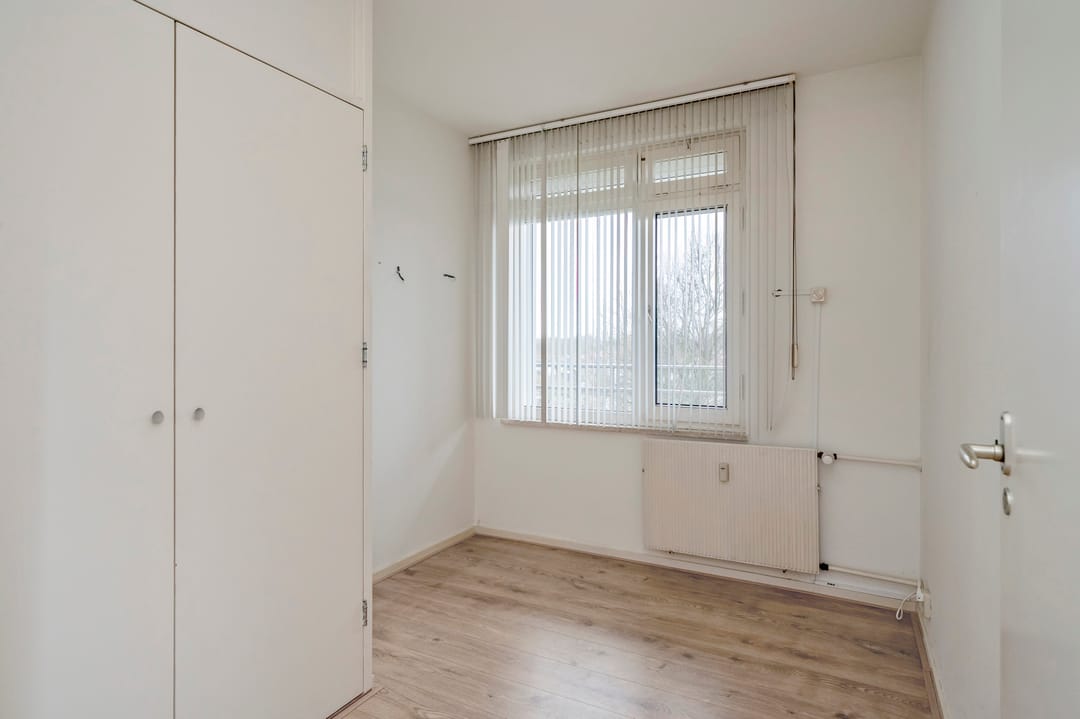 Spacious Three-Bedroom Apartment with South-Facing Balcony and Elevator in Green Setting — 23