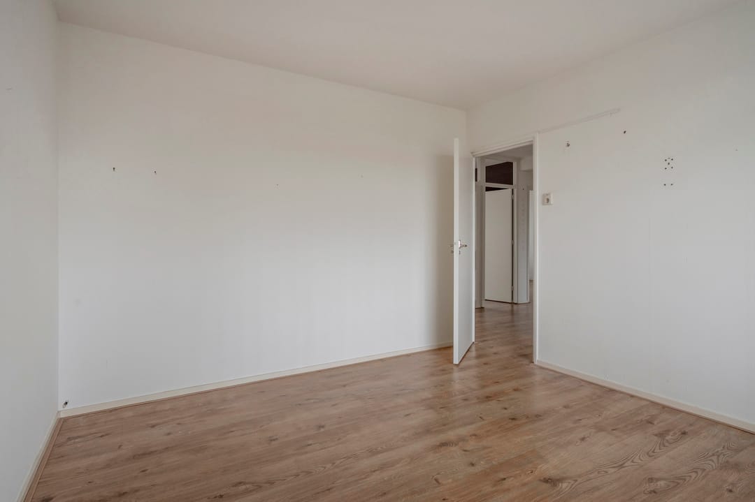 Spacious Three-Bedroom Apartment with South-Facing Balcony and Elevator in Green Setting — 22