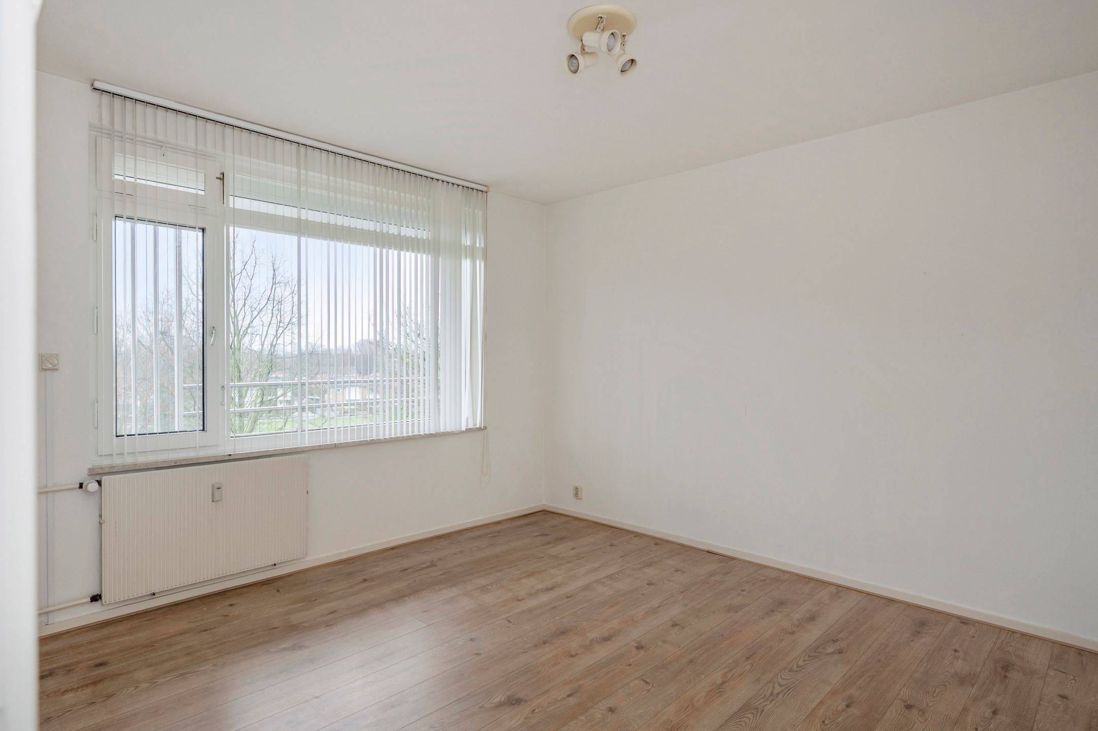 Spacious Three-Bedroom Apartment with South-Facing Balcony and Elevator in Green Setting — 21