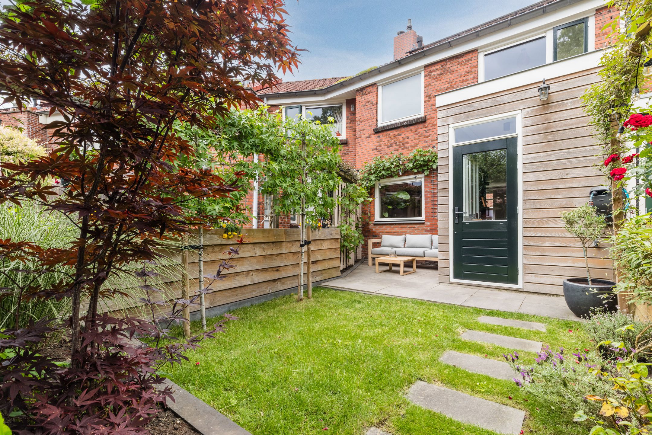 Modern three room tussenwoning with sun filled west garden — 24